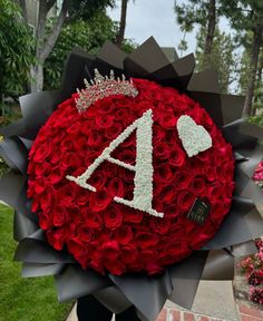 a large red rose bouquet with the number four on it