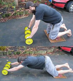 two men playing with frisbees in the driveway