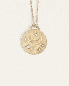 Temple of the Sun Cosmo Necklace, hand-crafted in Byron Bay in ethical gold and responsibly sourced diamonds. Shop fine jewellery and coin necklaces. Celestial Style 14k White Gold Necklace, Fine Jewelry White Gold Coin Pendant, Yellow Gold Medallion Jewelry With Moon Charm, Yellow Gold Medallion With Moon Charm, Celestial 14k Gold Medallion Jewelry, Celestial Jewelry With Coin Pendant For Anniversary, Celestial 14k Gold Round Pendant Jewelry, Celestial Sterling Silver Necklace With Single Cut Diamonds, Celestial Diamond Necklace With Diamond Accents