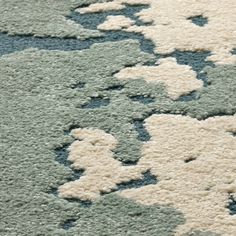 a blue and white rug with flowers on it