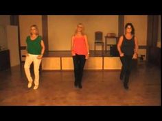 three women are dancing in a dance studio