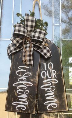 a wooden sign hanging from the side of a building