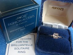 This is a Sterling Silver Brilliantelle solitaire ring by Avon in 1979. It has the brilliance and cut of a real 1 carat diamond ring  It is a ring size 7, old stock, but new in the box and never worn. 1 Carat Diamond Ring, Avon Rings, Avon Fashion, Rhinestone Heart, Vintage Rhinestone, Ring Size 7, 1 Carat, Solitaire Ring, Vintage Sterling Silver