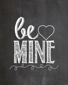 the words be mine written in chalk on a blackboard with a white heart above it