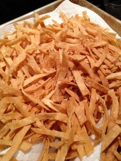 a pile of potato chips sitting on top of a paper towel