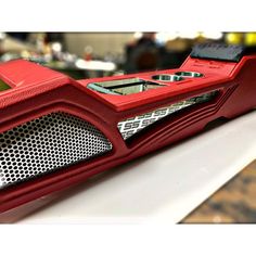 a red radio sitting on top of a table