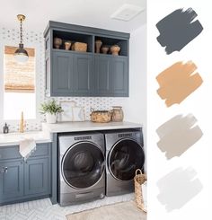 a washer and dryer in a laundry room with blue cabinets, white tile flooring and gray walls