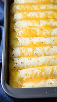 a pan filled with cheese and tortilla shells