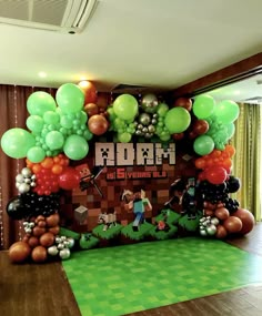 an image of a minecraft themed birthday party with balloons and streamers on the wall