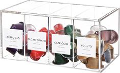 an acrylic display case with different colors of shoes in it and labels on each side