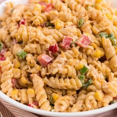 a bowl filled with macaroni salad on top of a table