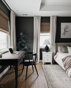 a bedroom with a bed, desk and chair in it's centerpieces