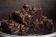 chocolate brownies stacked on top of each other in a bowl