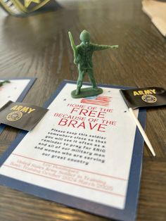 a toy soldier is standing on top of a paper that says free because the brave