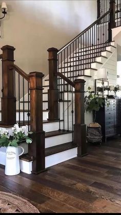 the stairs are made of wood and wrought iron