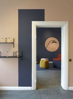 an open door leading into a room with blue walls