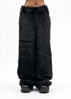 Faux fur devil pants in black from kidill. features a relaxed construction with four-pocket styling and a tail charm secured at the rear hem with a silver-tone lobster-claw mechanism. tonal stitching throughout.    oversized fit  shell: 100% polyester  lining: 100% polyester  made in japan    model is wearing size 46    model is 5'7" (172 cm) 98 pounds (44kg) usually wears s in tops. a size 25in denim and s in trousers. size 8 in shoes. Fur Pants, Japan Model, Leather Heeled Boots, Denim Hat, Straight Trousers, Patent Leather Heels, Black Faux Fur, Engineered Garments, Sweater And Shorts