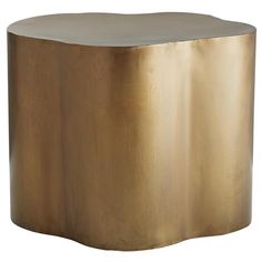 a round metal table with a gold finish