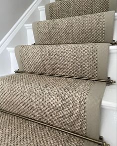 an image of some stairs with carpet on them