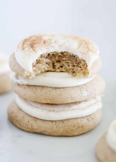 a stack of cookies with white frosting on top