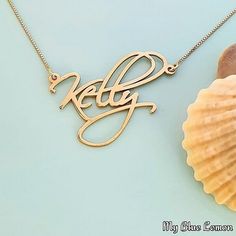 Order any name for your solid 14K gold Kelly Artistic style nameplate necklace!! A great personalized custom made gift for any occasion!! Birthday, Graduation or Any Holiday! *Both the nameplate and chain are all solid 14k gold. *Stamped for authenticity 14K (Hallmarked 14k) *Nameplate is 0.9 mm high quality thickness. *Font is larger than my other fonts, the capital will be approximately 1.3 cm tall *This listing is for one (1) name with one (1) capital letter only! Maximum is 9 letters. 10 or Elegant 14k Gold Custom Name Necklace, 14k Gold Nameplate Necklace With Initials, 14k Gold Initials Name Necklace For Personalized Gift, Silver 14k Gold Name Necklace For Anniversary, Classic Custom Nameplate Necklace, Customizable 14k Gold Name Necklace, Classic Nameplate Necklace For Personalized Gift, Customizable 14k Gold Name Necklace For Anniversary, Custom Gold Name Jewelry