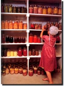 a woman standing in front of shelves filled with jars