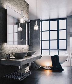 a bathroom with a tub, sink and large window