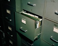 several filing cabinets with files in them