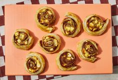 there are many different types of pastries on the tray