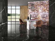 a dining room with marble flooring and walls decorated in floral wallpaper, along with modern chairs