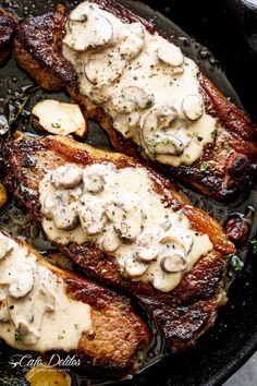 pork chops with mushroom sauce in a cast iron skillet