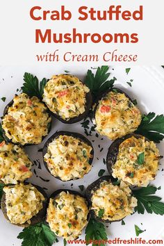 crab stuffed mushrooms with cream cheese on a white plate