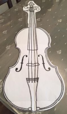 a drawing of a violin sitting on top of a table