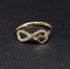 "14k Real Solid Yellow Gold Infinity Heart Ring, 14k Solid Gold Women Heart Ring, Infinity Symbol Gemstone Gold Ring for Women, Gift,  Gold Ring, Minimalist Ring * Metal : Real 14K Yellow Gold, (Properly Stamped, 14K)  * Condition : Brand New * Finish : Polished * Band thickness: 1.5 mm  * infinity Size: 17 mm length, 7mm width * Scale: : 6,5US, 7US, 7.5US,8US, 8.5US * Stone: Cubic Zirconia These Rings are 100% Authentic 14K Solid Real Gold .  \"Not Plated or Filled\" This is a Beautiful Genuine Real 14K Solid Gold  Infinity Ring BOSPHORUSGOLD" Infinity Heart Ring, Infinity Rings Gold, Infinity Gold Rings For Women, Infinity Gold Ring, Gold Infinity Promise Jewelry, Infinity Heart Ring For Valentine's Day Anniversary, Elegant Infinity Heart Ring For Promise, Infinity Promise Ring For Valentine's Day, Valentine's Day Infinity Heart Ring For Anniversary