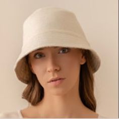 New! A versatile accessory, a Reversible Baby Alpaca Bucket Hat, that delivers two stylish looks in one. Meticulously crafted from a luxurious blend of 65% baby alpaca, 20% merino wool, and 15% nylon, this hat offers unparalleled comfort and sophistication. Choose between different patterns: a timeless plaid pattern or a sleek, unicolor design to match any occasion. Some styles feature a unique textured side or an elegant Pied de Poule pattern paired with a solid side. Great for the city or embr White Wool Casual Hat, Beige Reversible Hat With Curved Brim, Adjustable Soft Knit Cream Hat, Adjustable Cream Soft Knit Hat, Adjustable Cream Soft Hat, Adjustable Soft Cream Hat, Reversible Bucket Hat For Everyday Use, Cream Lightweight Everyday Hat, Cream Bucket Hat For Everyday