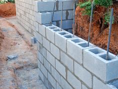 a cinder block wall being constructed with concrete blocks