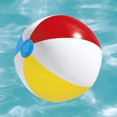 an inflatable beach ball floats above the water