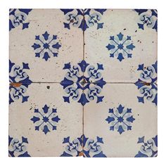 a blue and white tile pattern with snowflakes on it