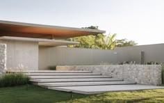 an outdoor area with stone steps and grass