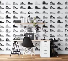 an office with a desk and shelves full of shoes on the wall, next to a chair