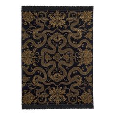 a black and gold rug with an intricate design