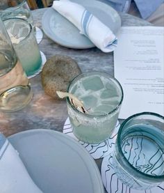 a table topped with plates and glasses filled with water