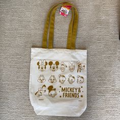 Bnwt Daiso X Disney Mickey Mouse And Friends Canvas Tote Bag In Natural/Mustard Yellow. This Can Be Your Next Everyday Tote Bag To Show Your Love For Disney. There Are Just Some Marks On The Bottom Of The Tote Bag But Should Come Off When You Hand Wash It. Material 70% Polyester 22% Cotton 7% Rayon & 1% Elastin/Polyurethane Size Length 13” X Height 15” Width 3.5” Disney Tote Bags Diy, Disney Yellow School Bag, Yellow Disney School Bag, Disney Yellow Bags For Everyday Use, White Mickey Mouse Bag For Disney Fan Events, Disney Tote Bag, Disney Tote Bags, Disney Tote, Friend Canvas