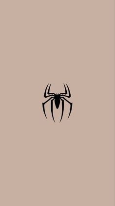 a black spider logo on a beige background