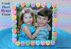 two children are posing in front of a heart shaped frame