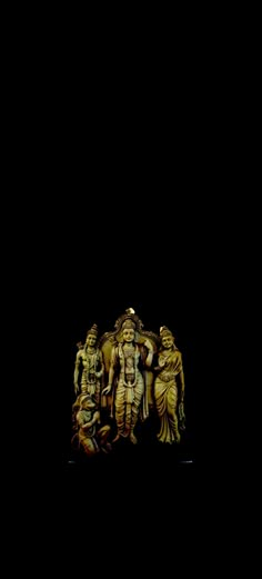 an intricately carved statue is shown against a black background