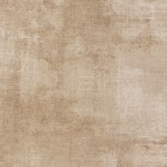 an old, worn and stained rug with some stains on it's surface in light brown tones