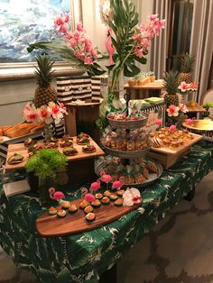 an assortment of desserts and pastries on a table