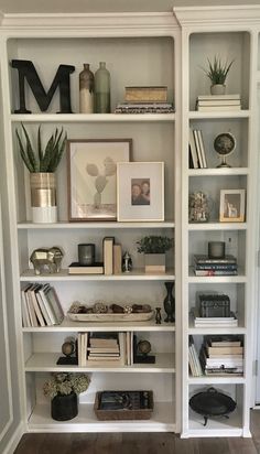 a bookshelf filled with lots of different types of books on top of white shelves