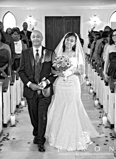 the bride and groom are walking down the aisle